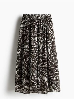 H&M brown patterned circle skirt with leaf 🍃 motif design.